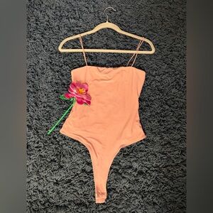 Papaya Peach Bodysuit with Pink Floral Detail
